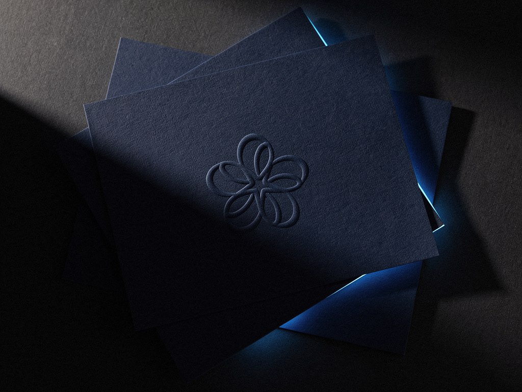 Dark textured brand stationery with an embossed flower mark, edged by a thin line of blue light